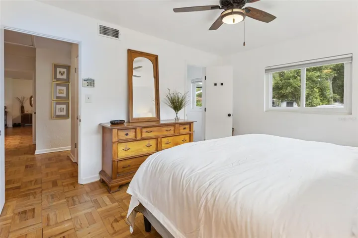 Primary Suite with wood floors and en suite bathroom