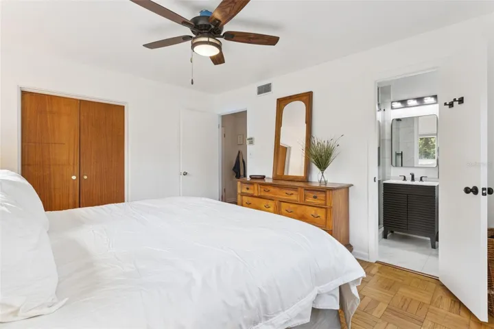 Primary Suite with wood floors and en suite bathroom