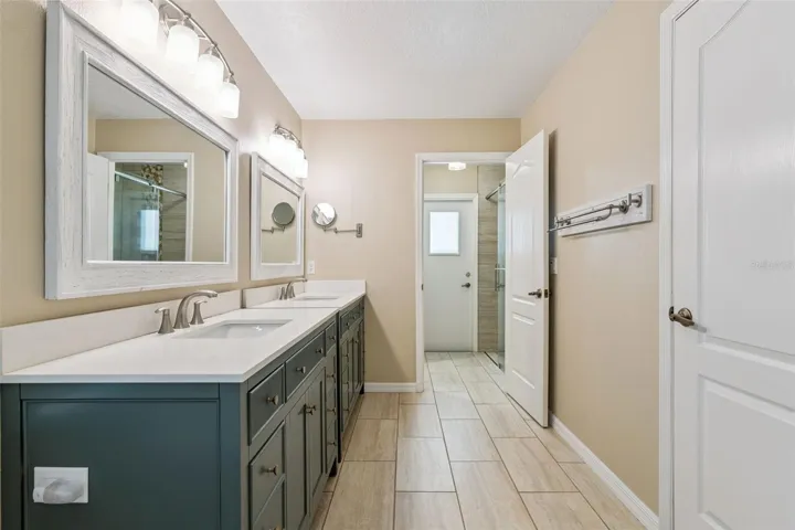 A door separates the shower and bathroom so it can double as a pool bath but keeps the primary private