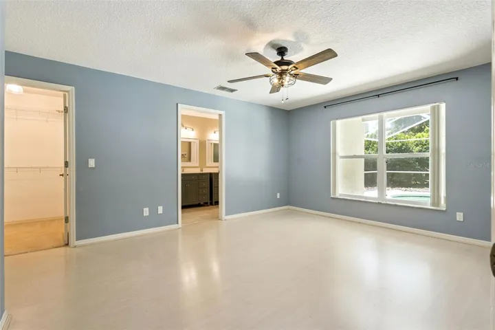 Primary suite with walk-in closet and ensuite bathroom