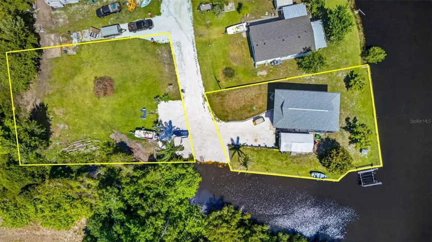 overhead view of property showing home and lots available also across street as outlined in yellow