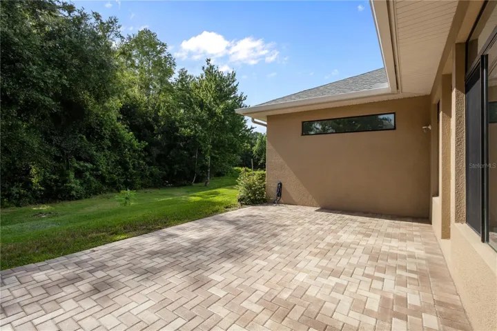 Extended paver lanai provides great space for outdoor entertainment