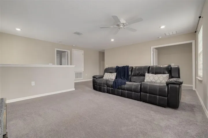 expansive loft perfect for a media room, game room, or additional living space - Upstairs