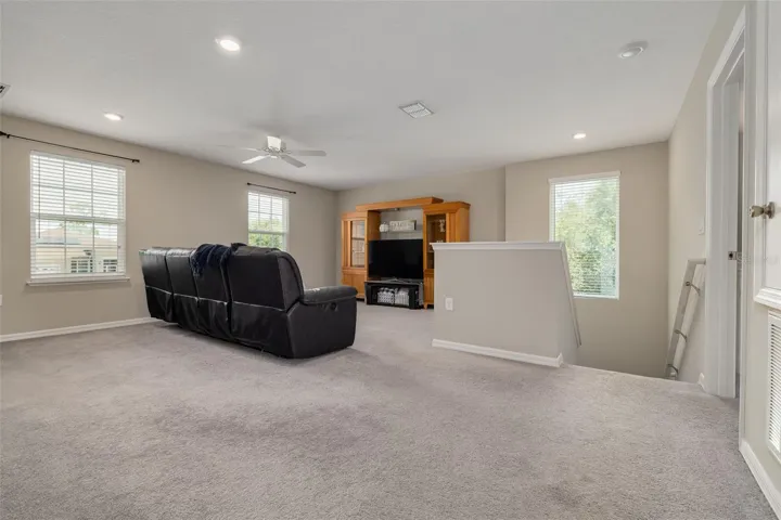 Expansive loft perfect for a media room, game room, or additional living space.- Upstairs