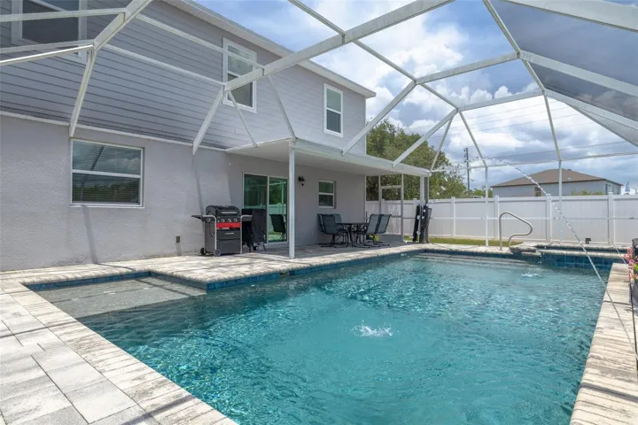 Beautiful waterfall, sun shelf, and spacious lounging deck.