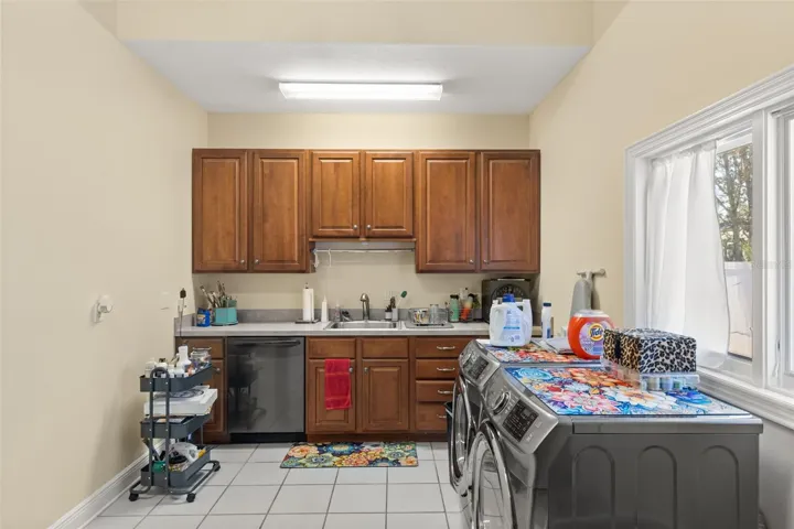 A well-appointed secondary kitchen, complete with a butler's pantry and adjacent laundry room, enhances the estae exceptional entertaining capabilities.