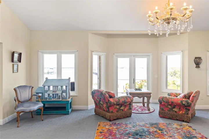 The luxurious first-floor master suite offers a separate sitting room, ideal for relaxation and privacy.