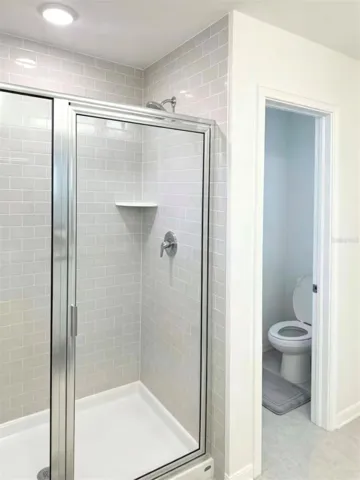 Primary Bathroom with shower and water room