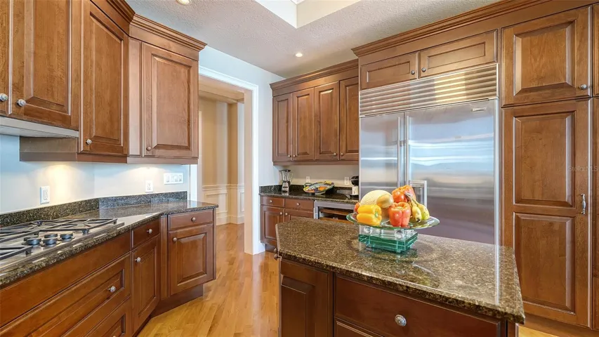 STONE COUNTERTOPS AND SOLID WOOD CABINETS