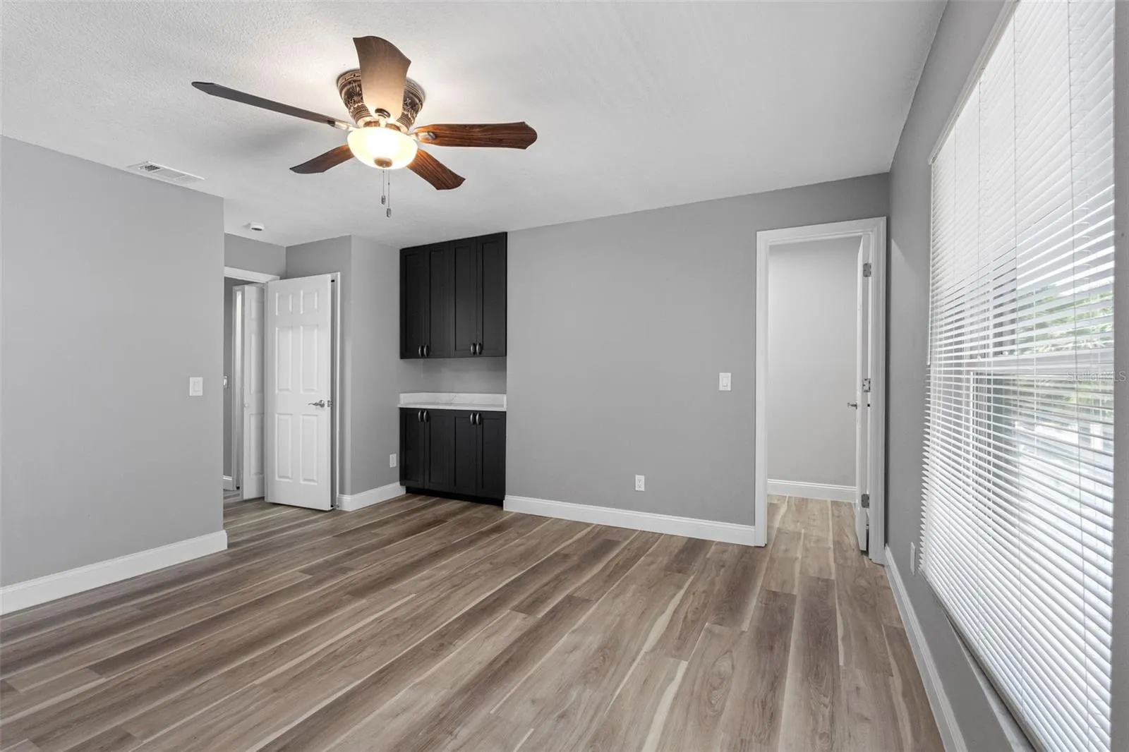PRIMARY BEDROOM WITH BUILT-IN STORAGE