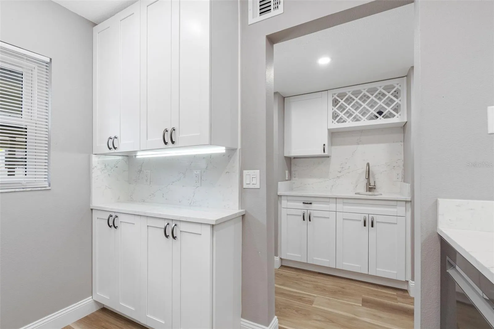 BUILT-IN STORAGE WITH UNDER CABINET LIGHTING IN KITCHEN