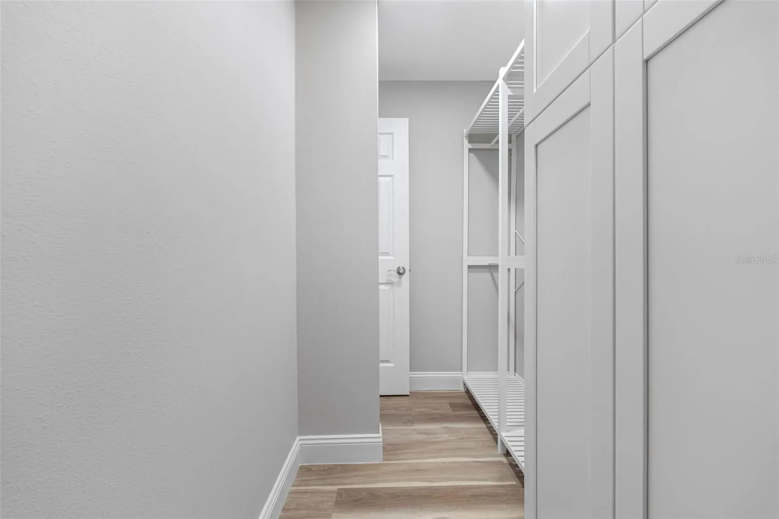 BEDROOM #2 (ENTRANCE TO WALK-IN CLOSET)