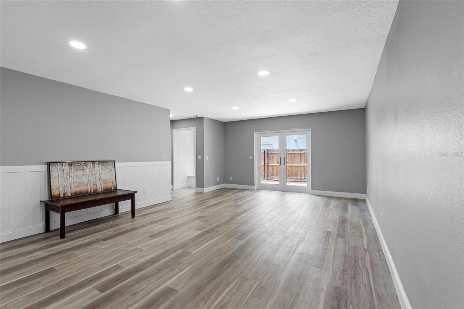 LIVING-DINING ROOM & ENTRY TO PATIO
