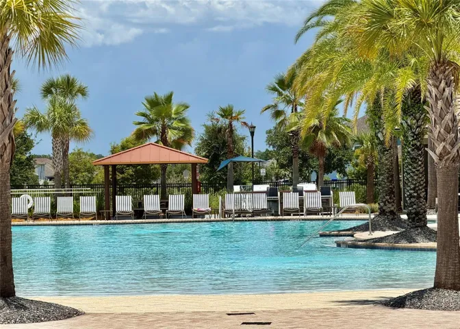 Tapestry Resort-style swimming pool featuring a beach-entry design