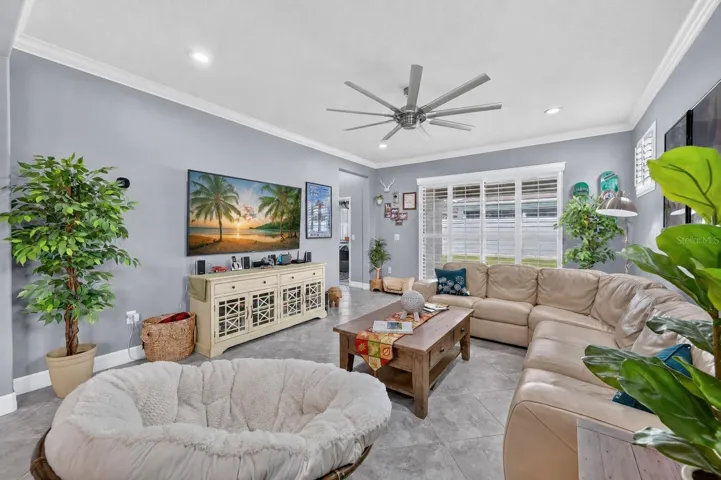 2465 Annacella Ave. - Spacious living area with custom plantation  shutters throughout