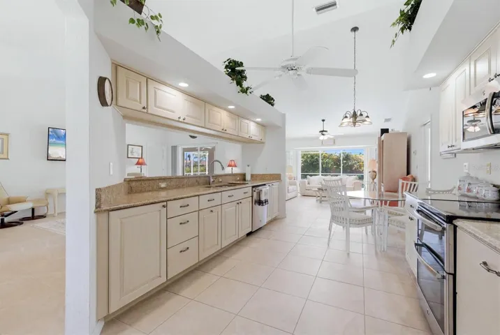 Kitchen, breakfast area &amp; Family Room in background.