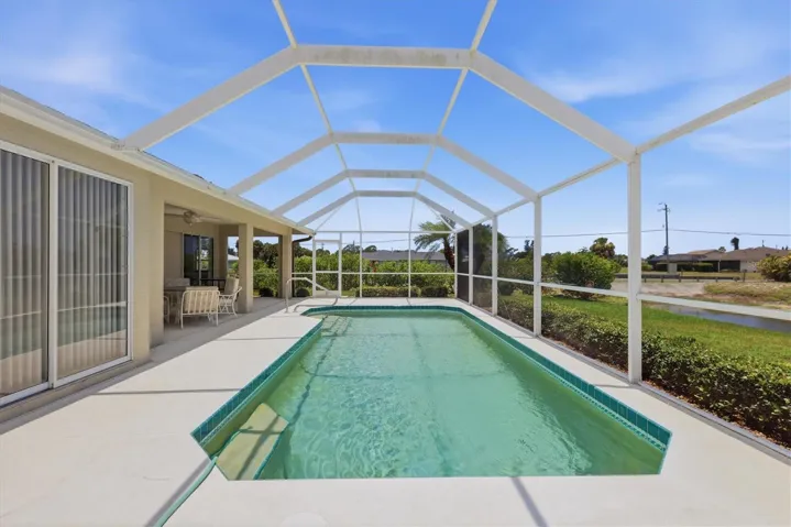 Heated Screened-in Pool &amp; Covered Lanai on the left.