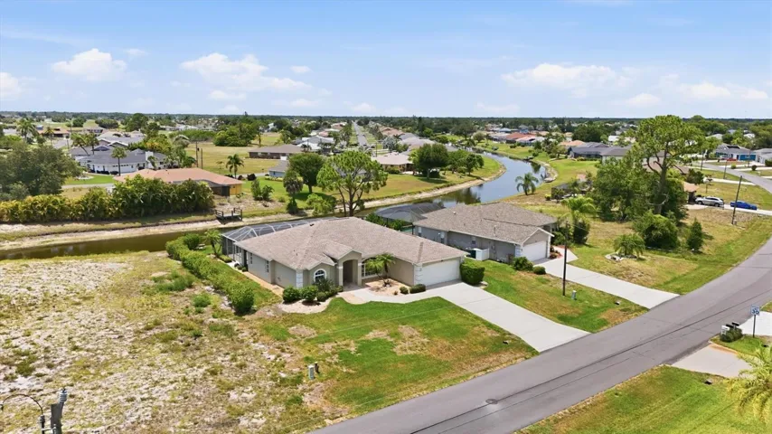 Aerial View of front. Canal in rear of home.