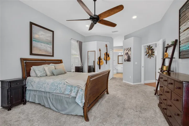 large primary bedroom opening to primary bath