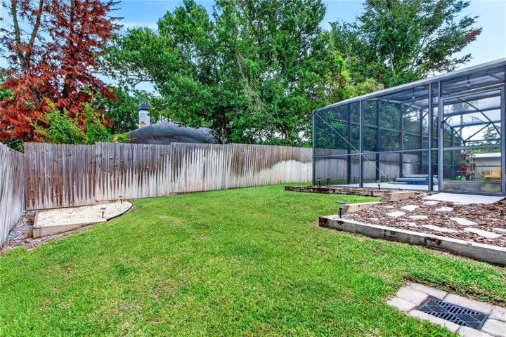 manicured back yard; water drains away from the home