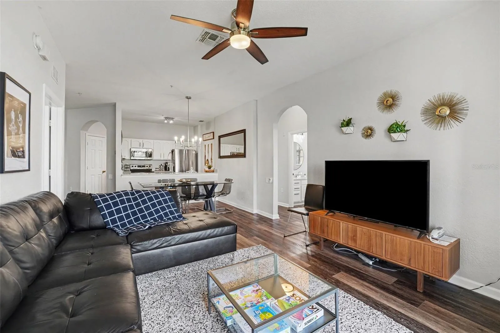 Upscaled decor with luxury vinyl flooring, plush area rug and modern style decor!