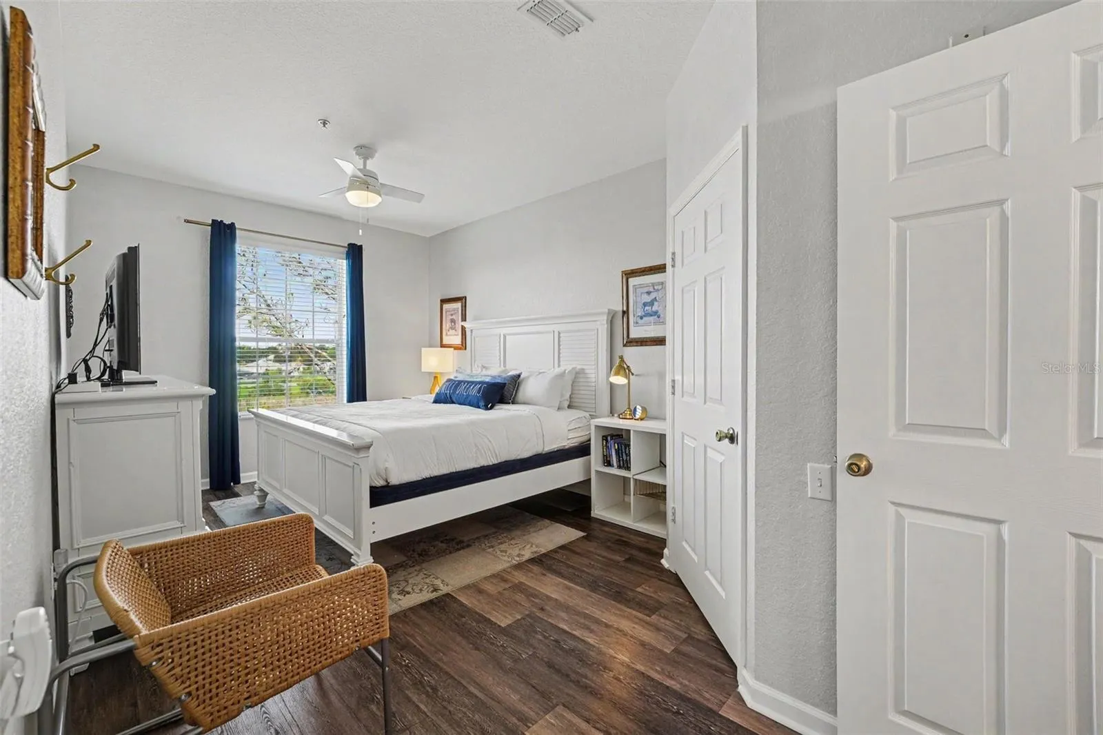Spacious primary bedroom with lake view