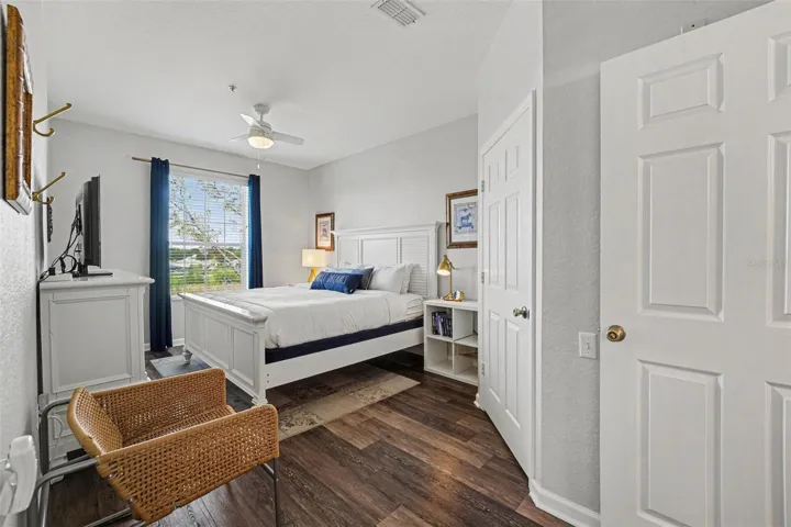 Spacious primary bedroom with lake view