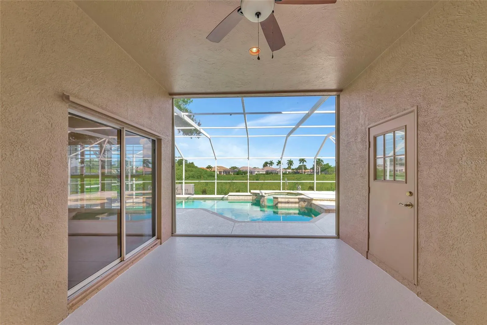 Deep covered lanai w/ view to pool &amp; spa.