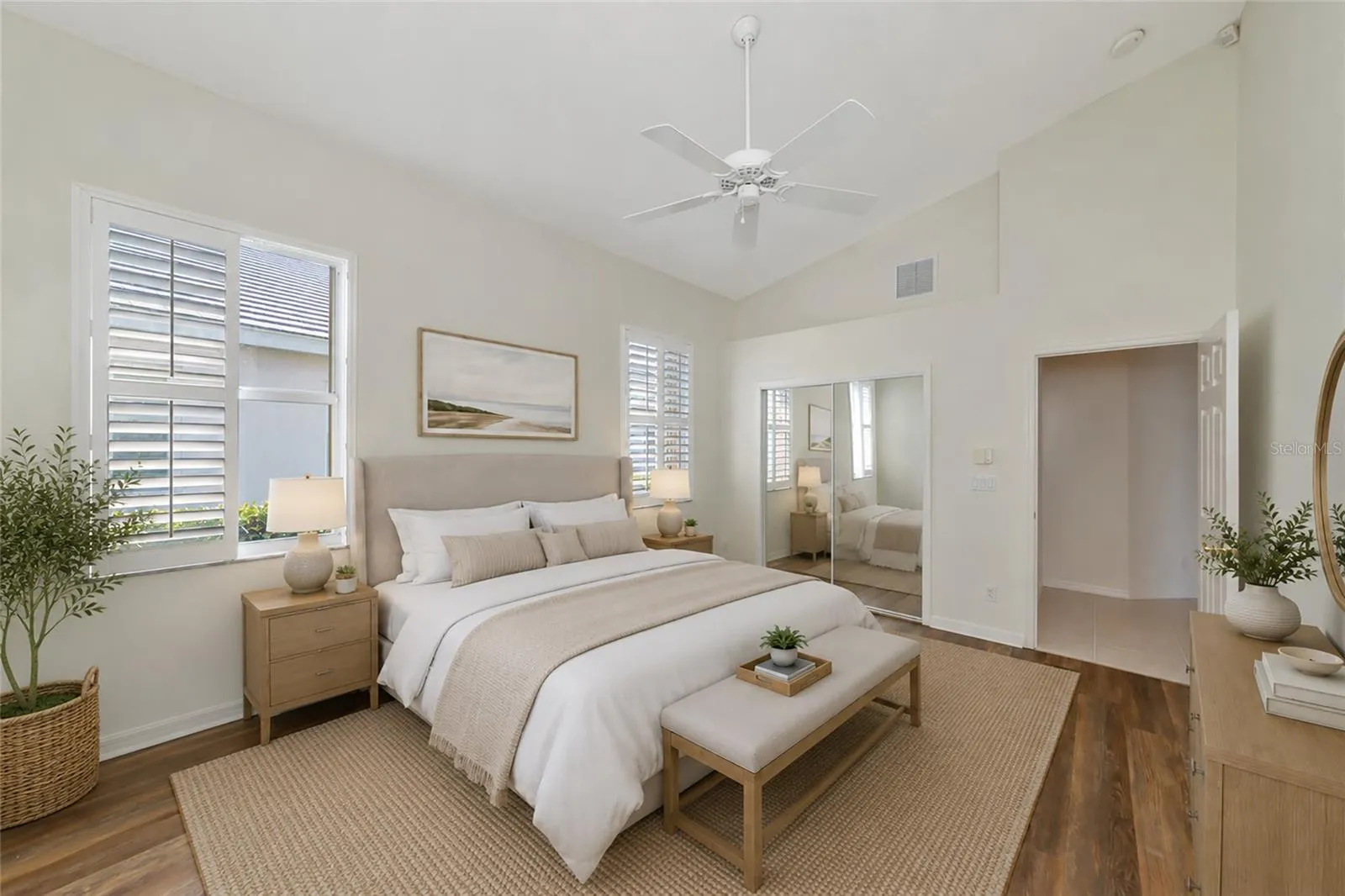 Staged. Primary suite w/ cathedral ceiling.