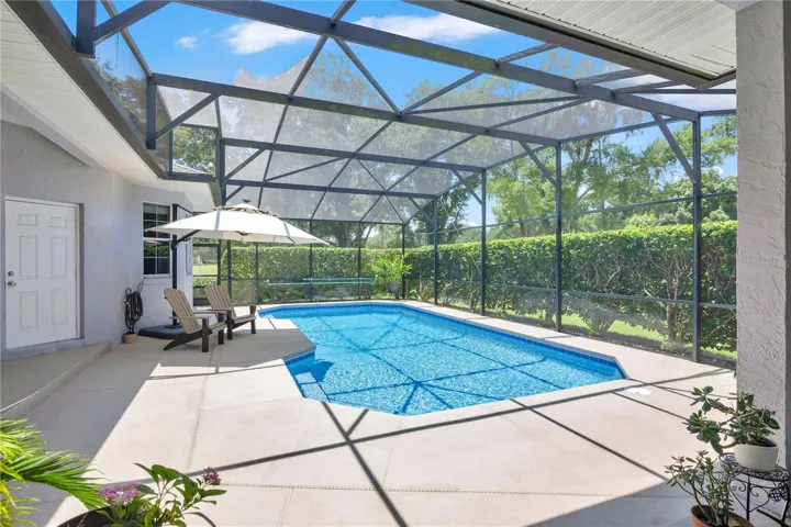 Large covered lanai perfect for entertaining and sitting outside listening to the birds chriping.