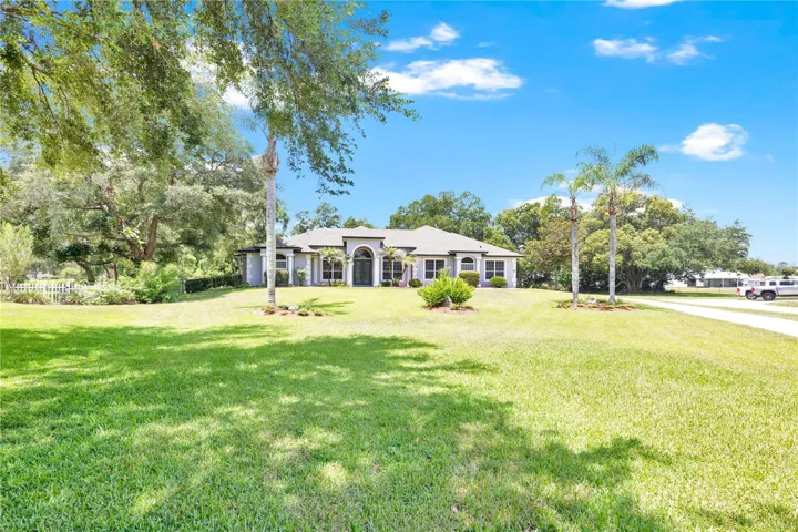Beautiful estate home on a large 1 acre lot set back for added privacy.