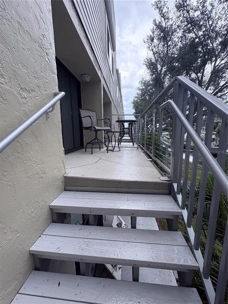 stair case from balcony to downstairs canal