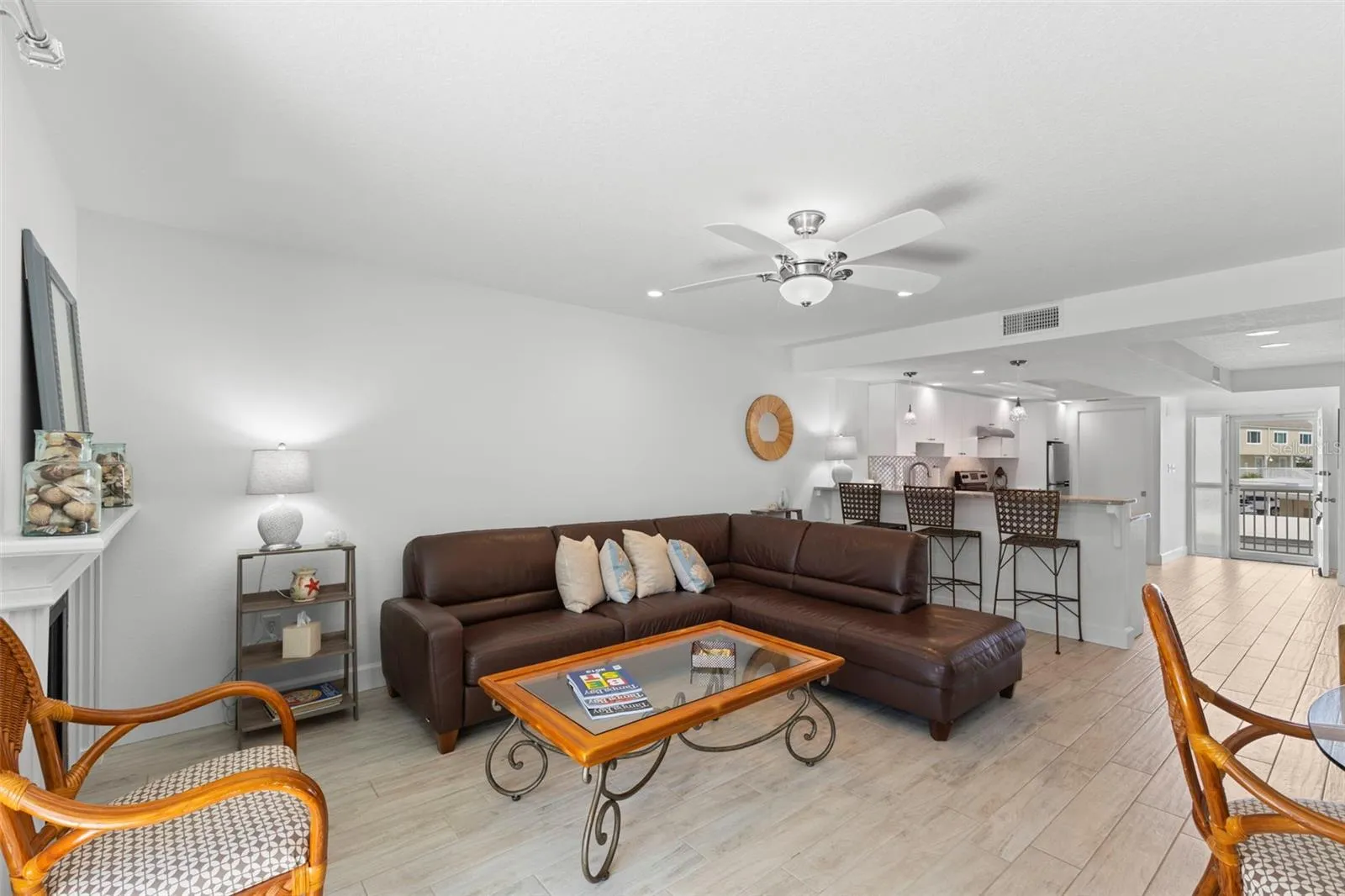 From slider to fireplace, living area and breakfast bar to front door