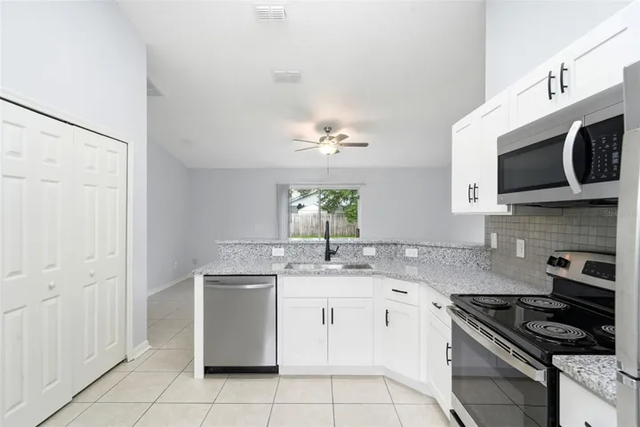 Renovated kitchen, granite counter tops, stainless steel appliances, New cabinets, tile floor