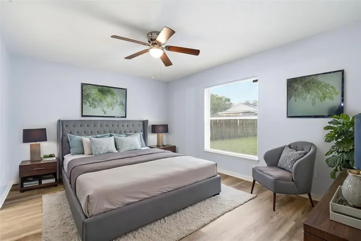 Primary Bedroom, LVP floor, ceiling fan, walk in closet
