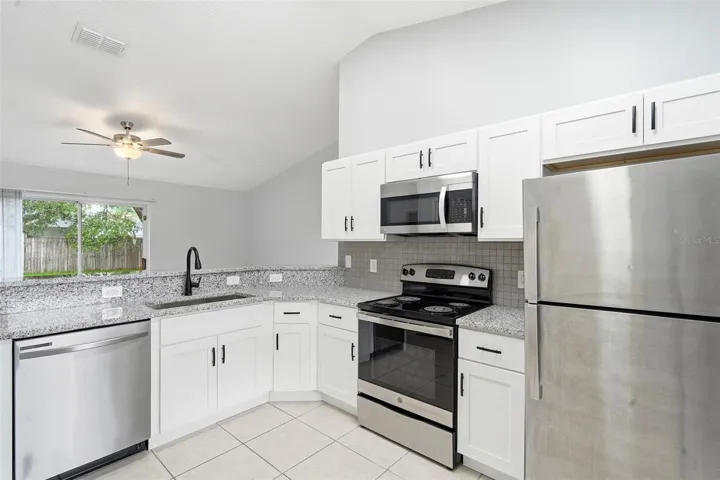 Renovated kitchen, granite counter tops, stainless steel appliances, New cabinets, tile floor