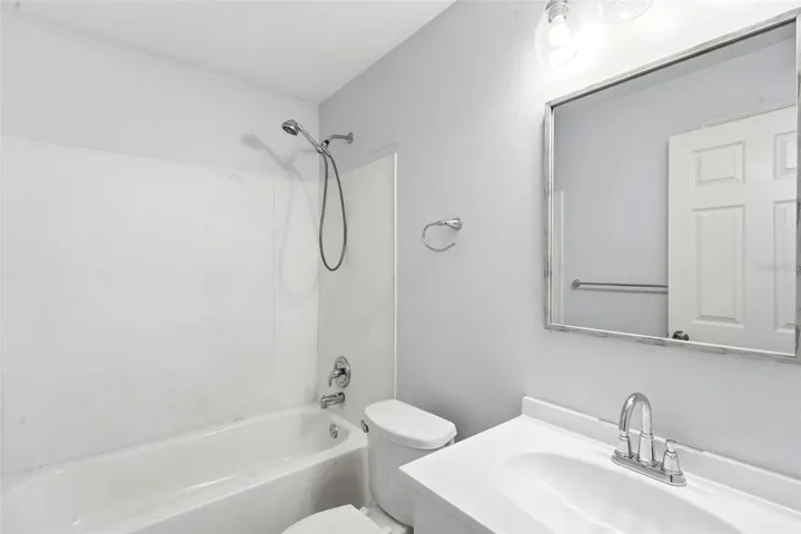 Guest Bath, renovated vanity and toilet, tub/shower