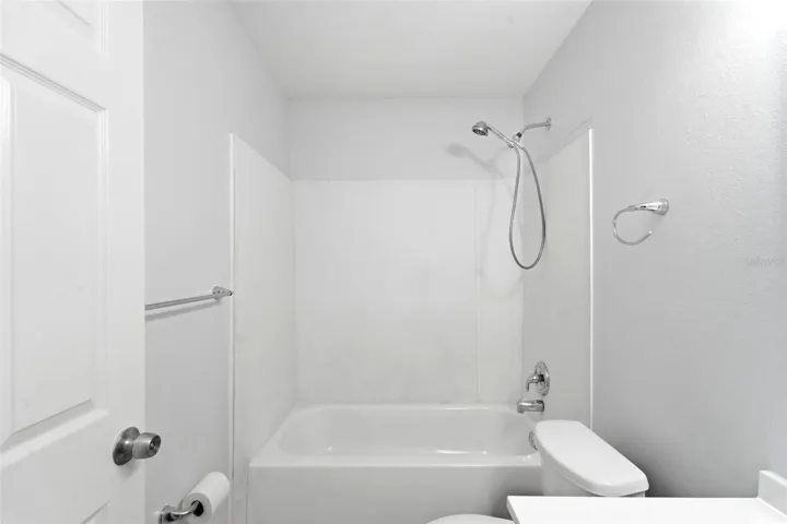 Guest Bath, renovated vanity and toilet, tub/shower
