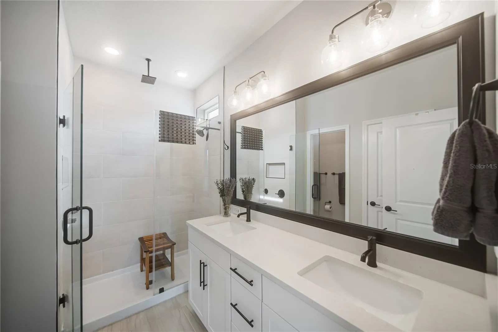 Walk-in linen closet behind door, next to water closet.