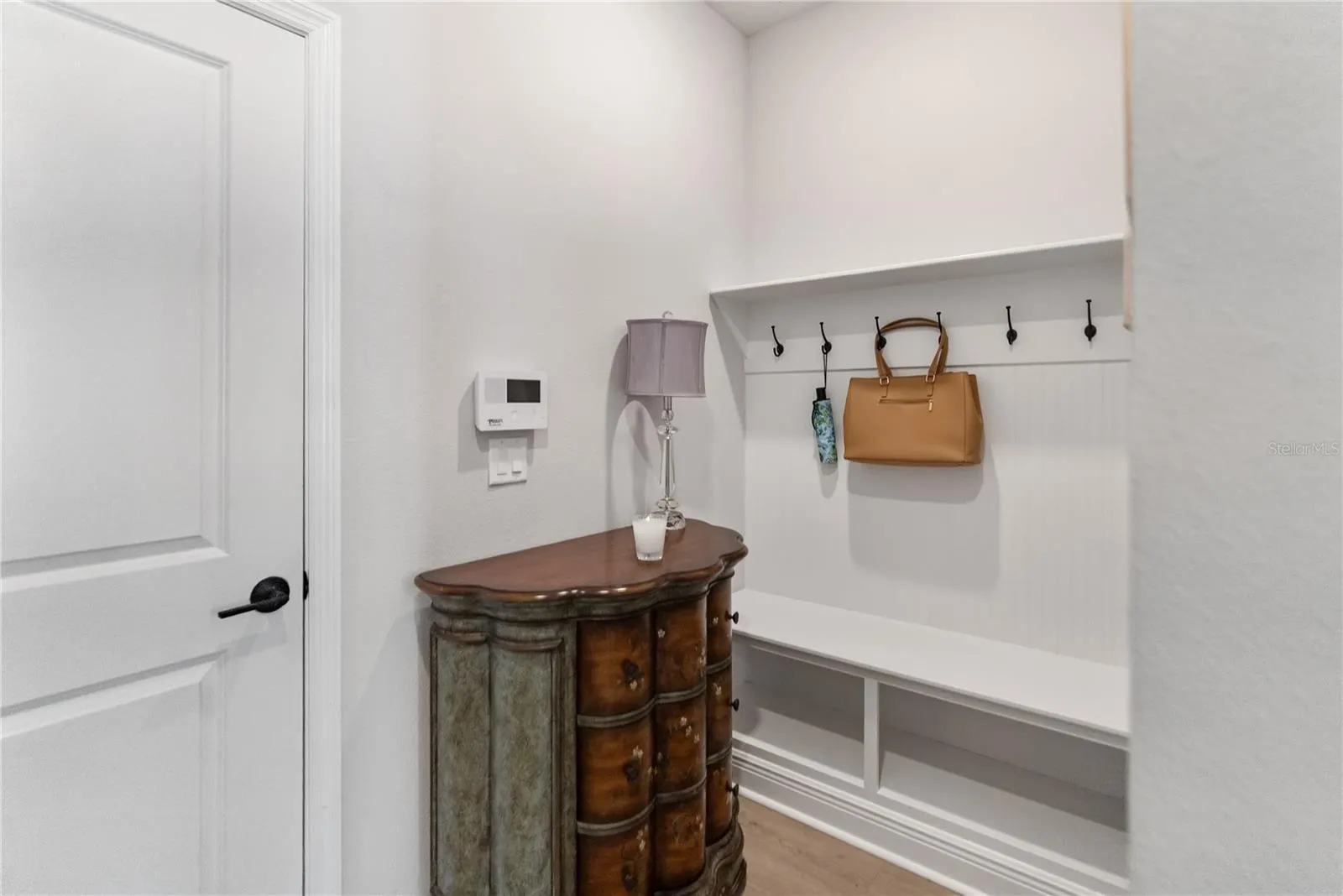 "Mud room" or "nook," and entrance to two-car garage.