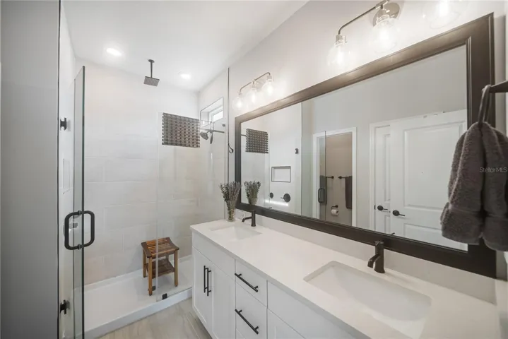 Walk-in linen closet behind door, next to water closet.