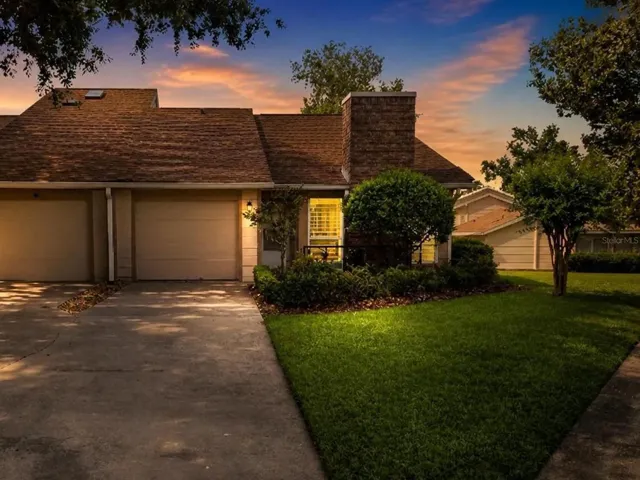 Front elevation of this beautifully maintained end-unit townhouse available for rent in the desirable Maple Townhouses neighborhood of Woodland Villages in Ocala, Florida.