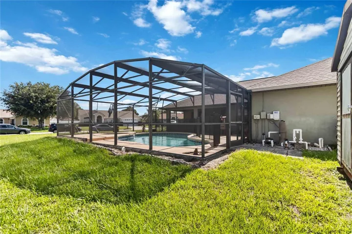 Rear of Home with Screen Enclosed, Inground Pool