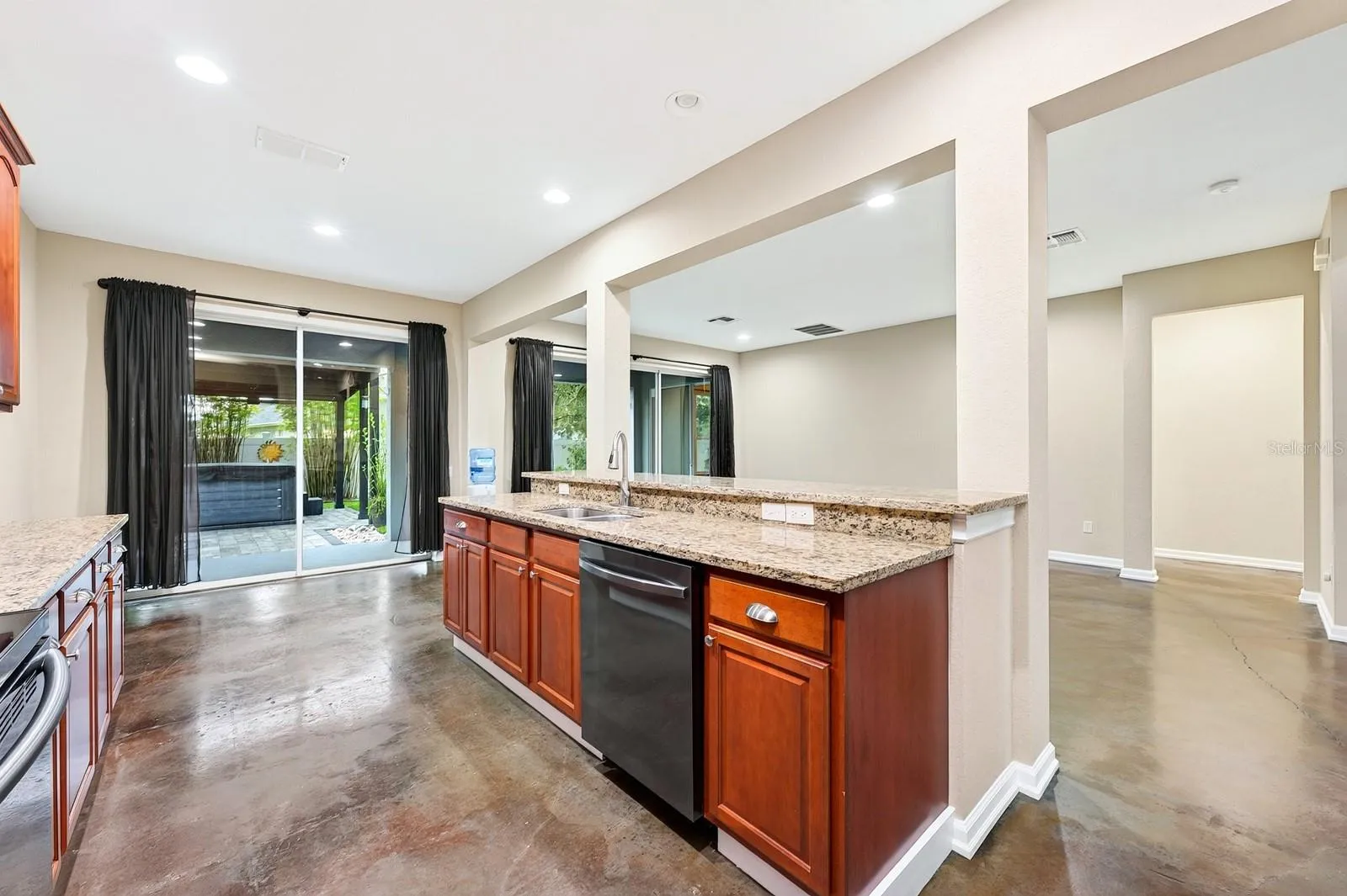 Kitchen is open to a casual dining area and generous living space.