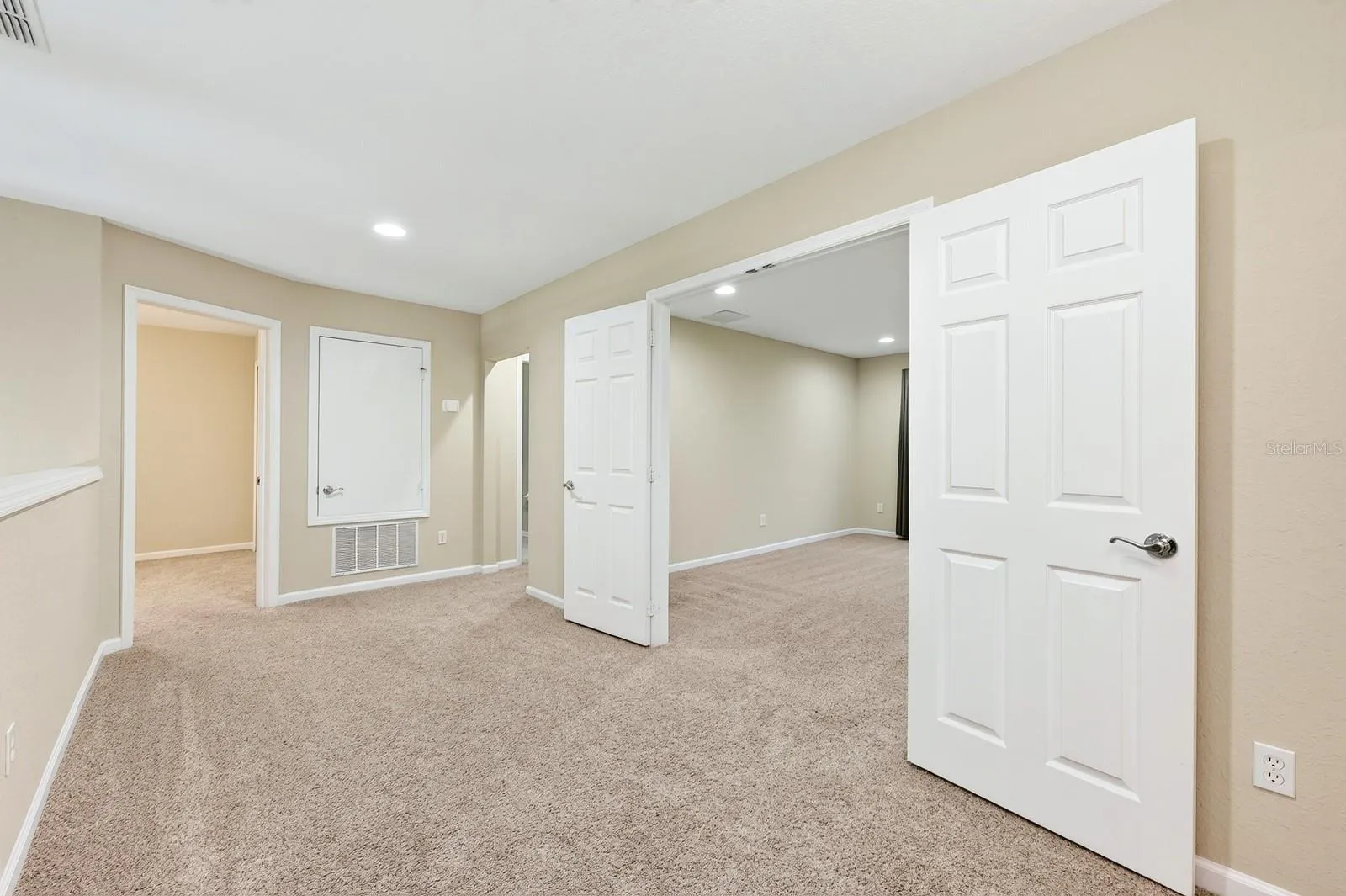 Double doors off the loft open to a bonus room.