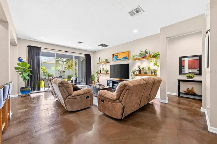 Open living area with a wall of sliding glass doors for the ultimate in indoor/outdoor living.