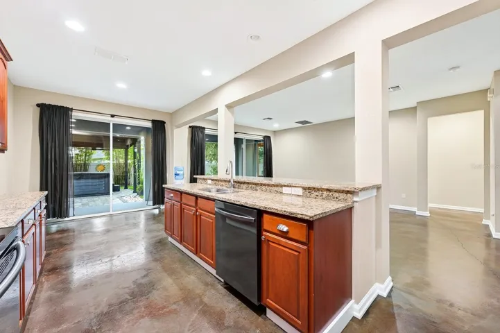 Kitchen is open to a casual dining area and generous living space.