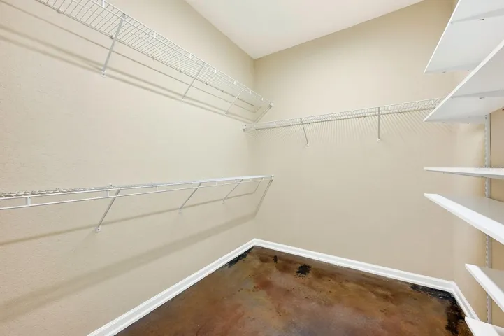 Primary suite walk-in closet.