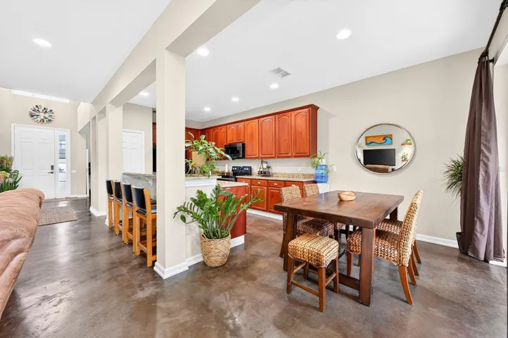 Kitchen is open the living and dining areas.
