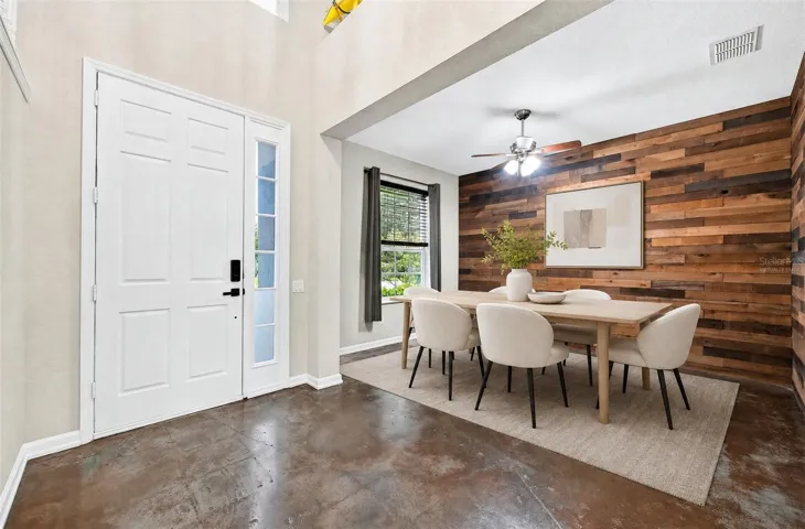 Flexible formal space at the front of the home. Virtually Staged.